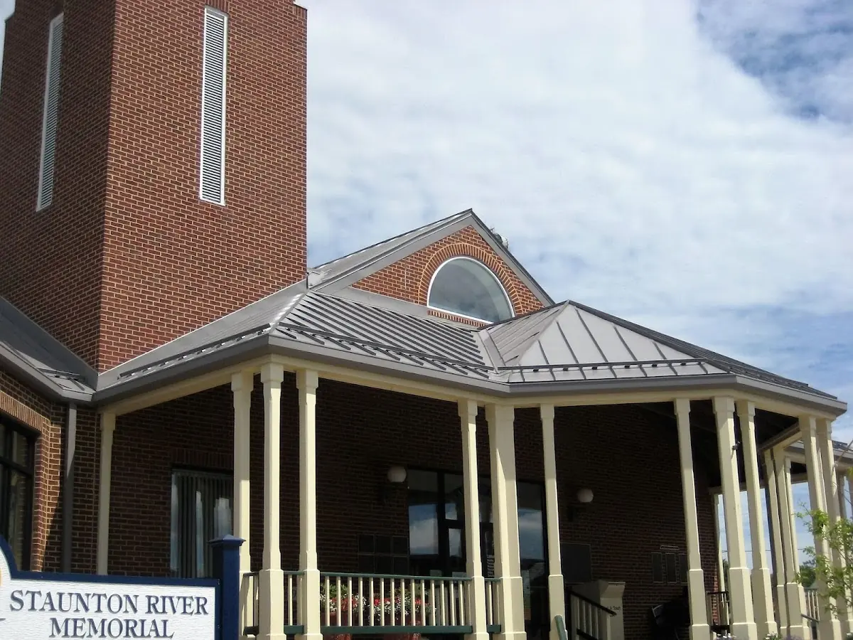 Skilled roofing craftsmen working on a residential roof in Oswego